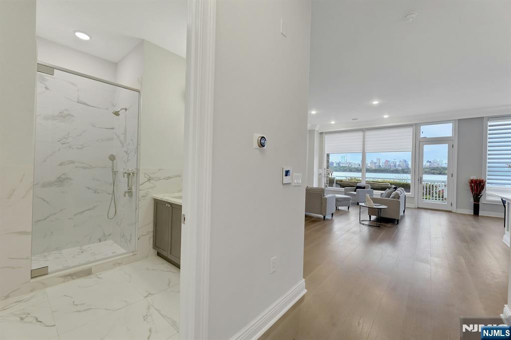 3 Somerset Lane, Unit 109 Edgewater, NJ 07020 - Photo 2 of 50 a view of livingroom with furniture and window