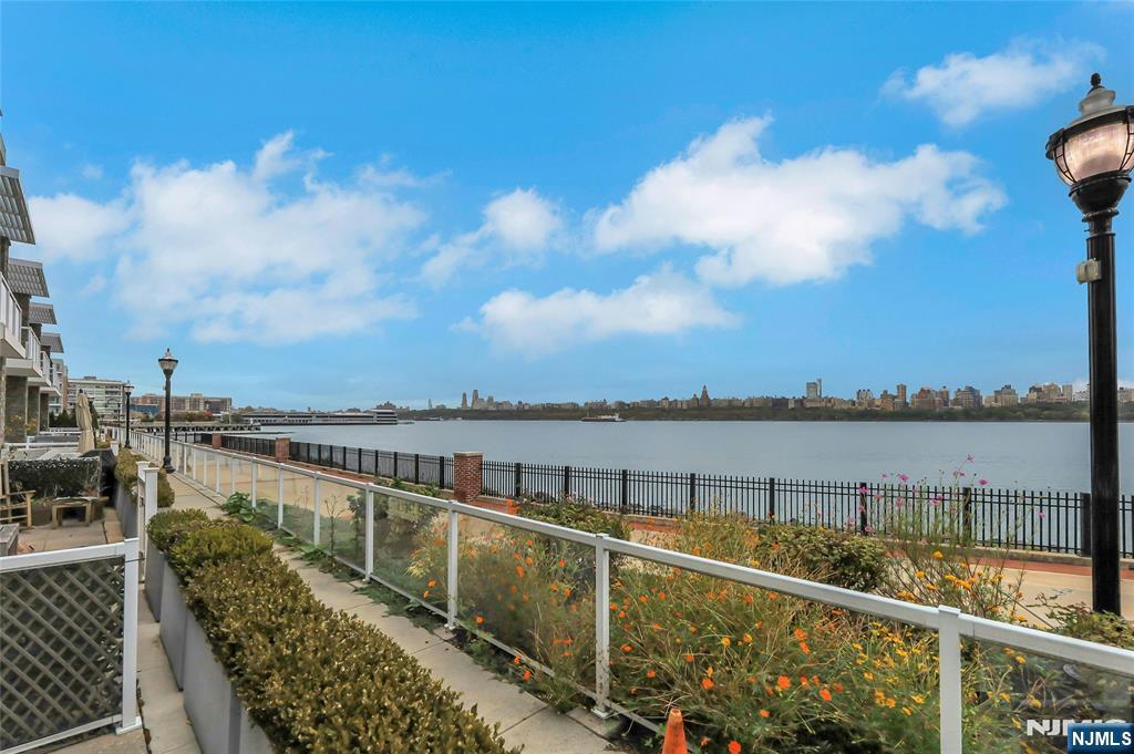 3 Somerset Lane, Unit 109 Edgewater, NJ 07020 - Photo 44 of 50 a view of a lake from a balcony