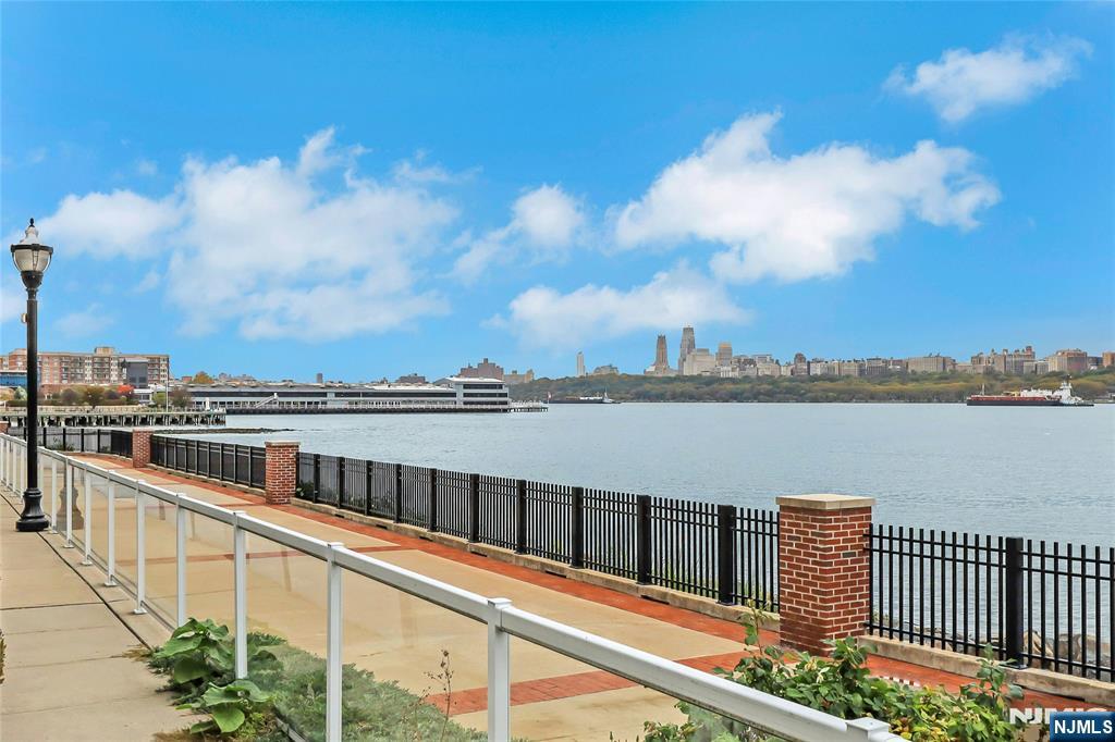 3 Somerset Lane, Unit 109 Edgewater, NJ 07020 - Photo 46 of 50 a view of a lake from a balcony