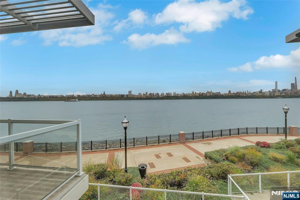 3 Somerset Lane, Unit 109 Edgewater, NJ 07020 - Photo 47 of 50 a view of a lake with a outdoor space