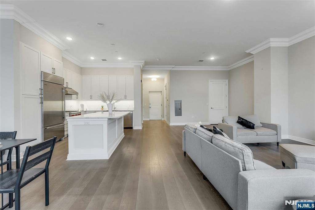 3 Somerset Lane, Unit 109 Edgewater, NJ 07020 - Photo 7 of 50 a living room with stainless steel appliances furniture refrigerator and a kitchen view