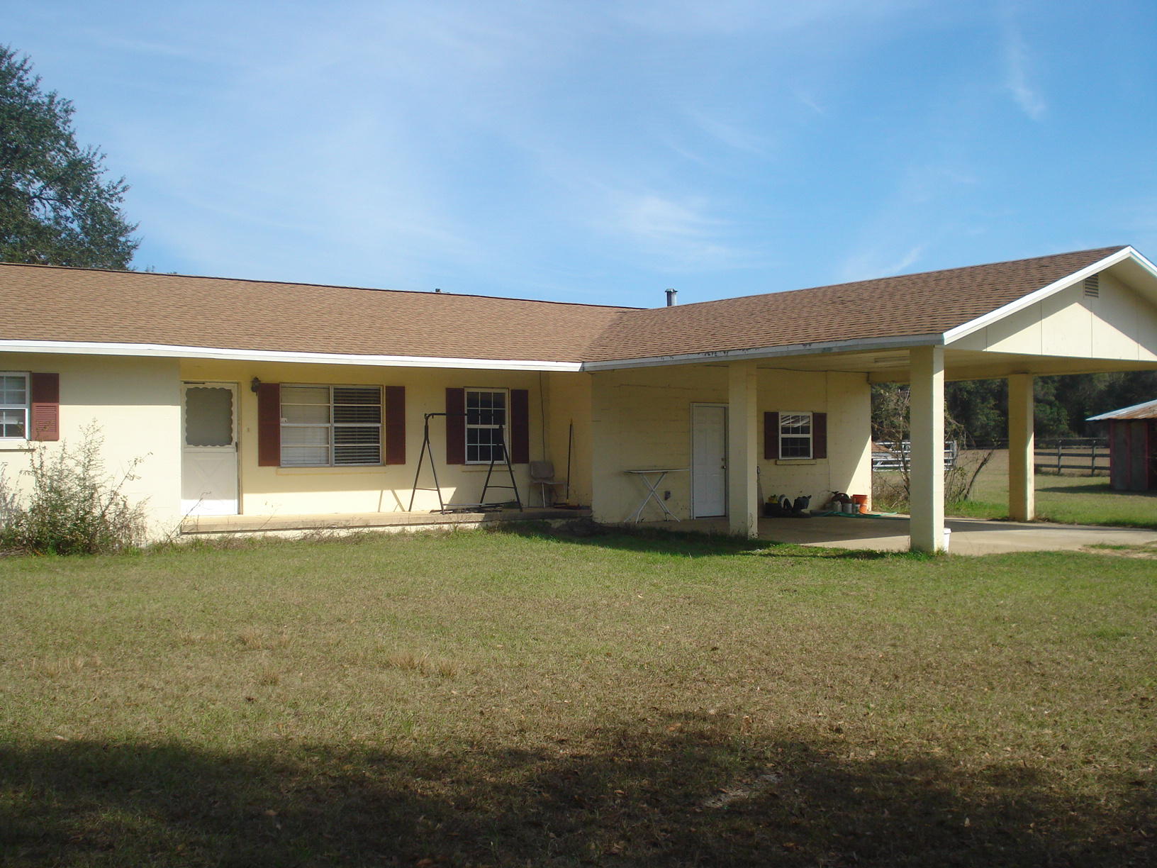 5629 Buckward Road Baker, FL 32531 - Photo 15 of 20 a front view of a house with a garden