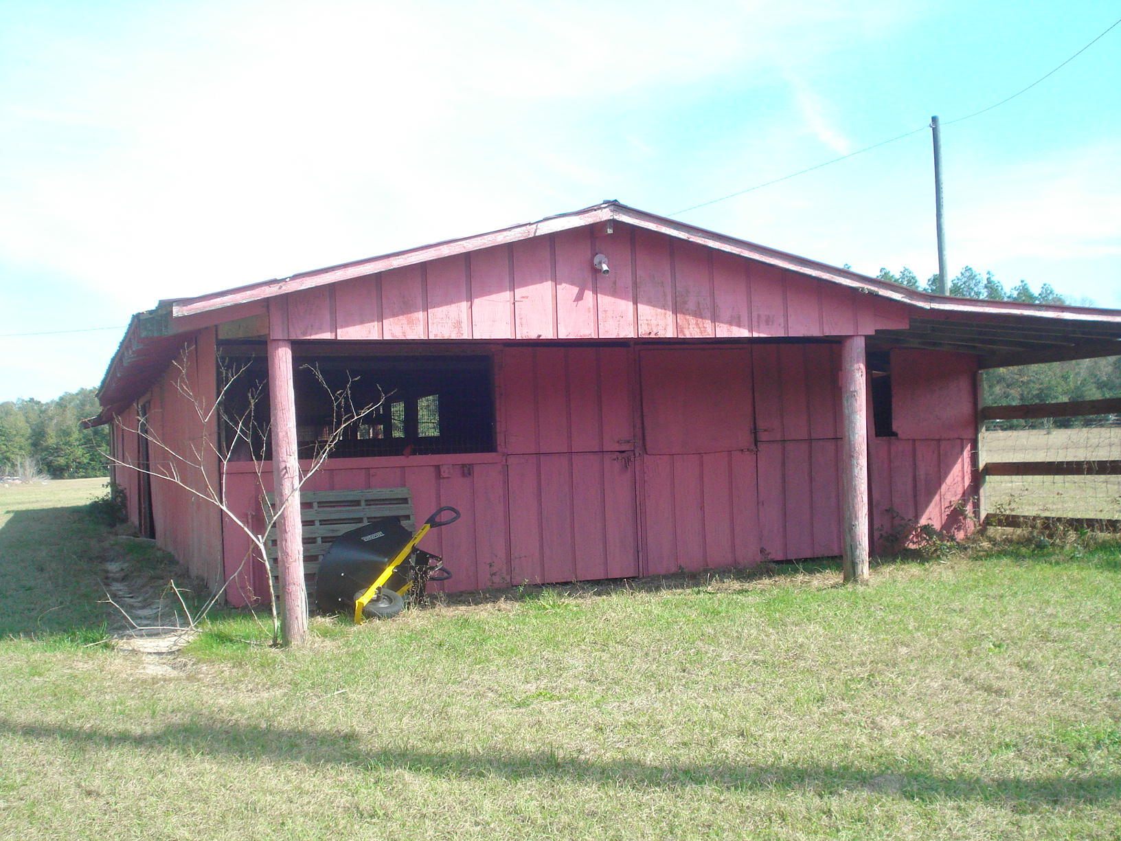 5629 Buckward Road Baker, FL 32531 - Photo 19 of 20 a view of a small barn front of a house