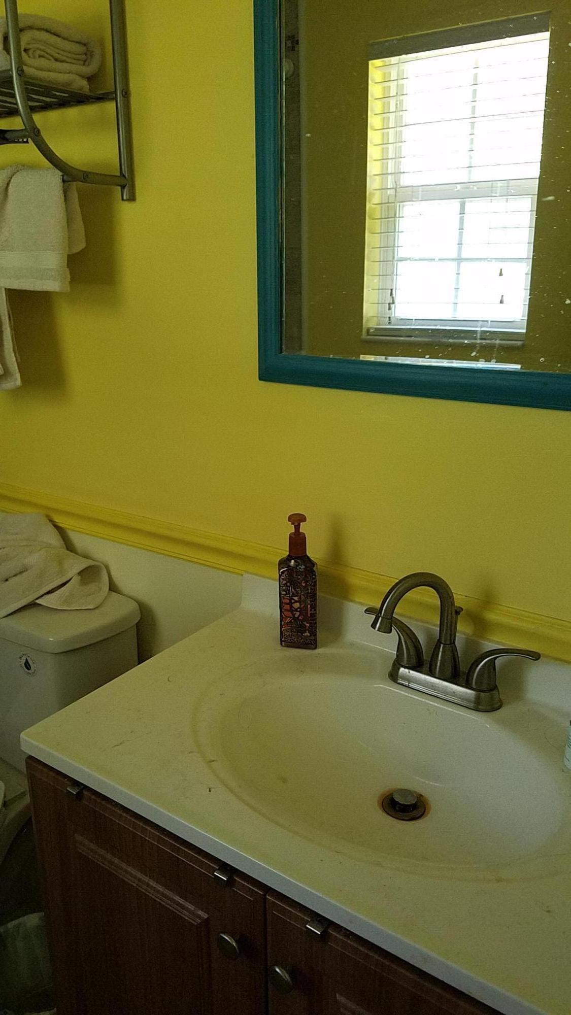 5629 Buckward Road Baker, FL 32531 - Photo 9 of 20 a bathroom with a sink and a window