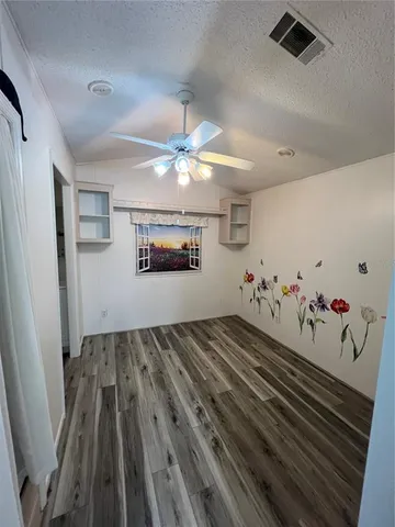 a view of a livingroom with wooden floor