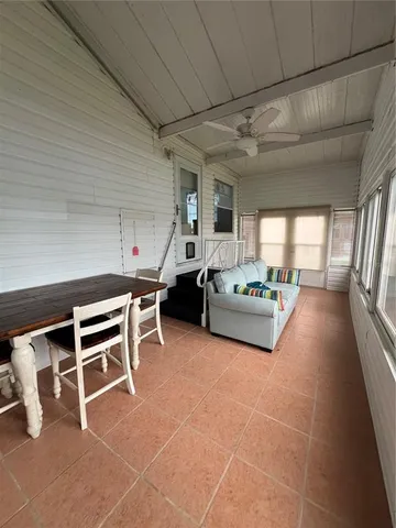 a view of balcony with wooden floor