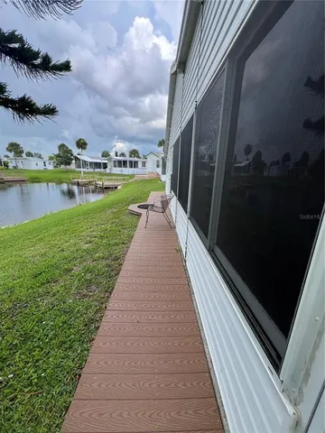 a view of a lake with houses in the back