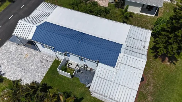 a view of a chair and table in the backyard