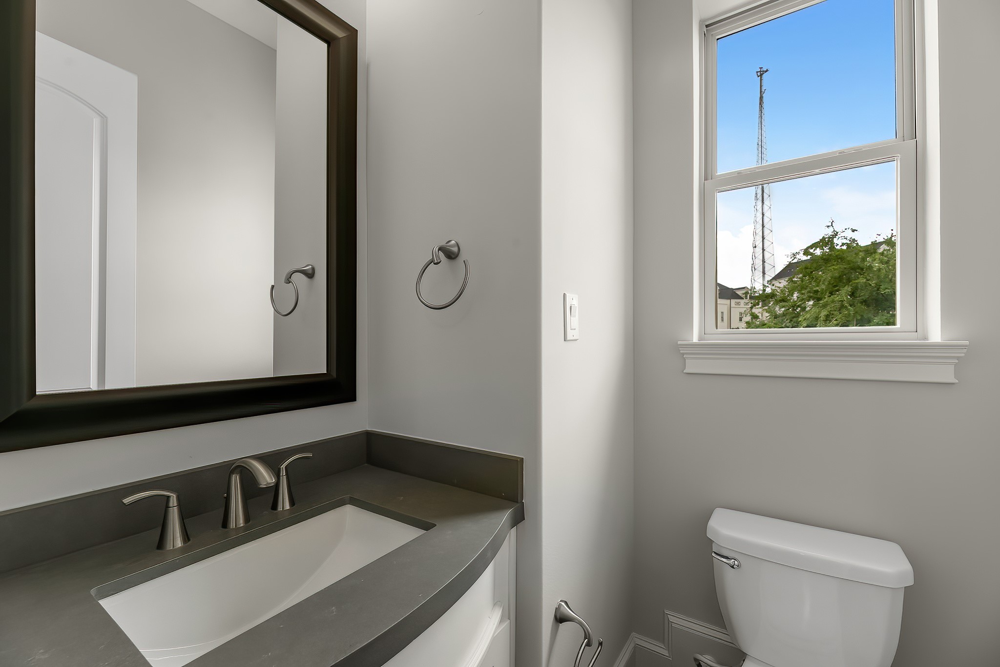 3709 Somerset Commons Lane Houston, TX 77055 - Photo 16 of 32 a bathroom with a toilet sink and mirror
