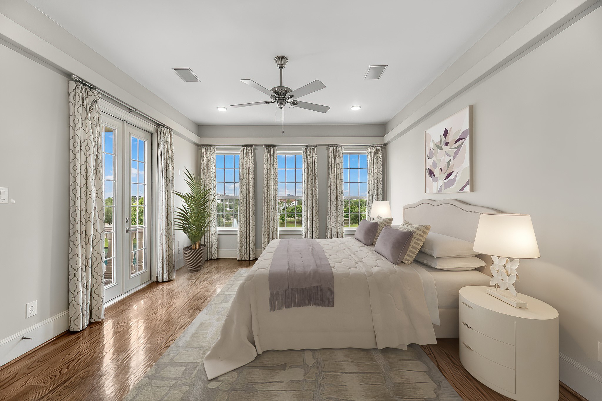 3709 Somerset Commons Lane Houston, TX 77055 - Photo 17 of 32 a spacious bedroom with a large bed and a chandelier