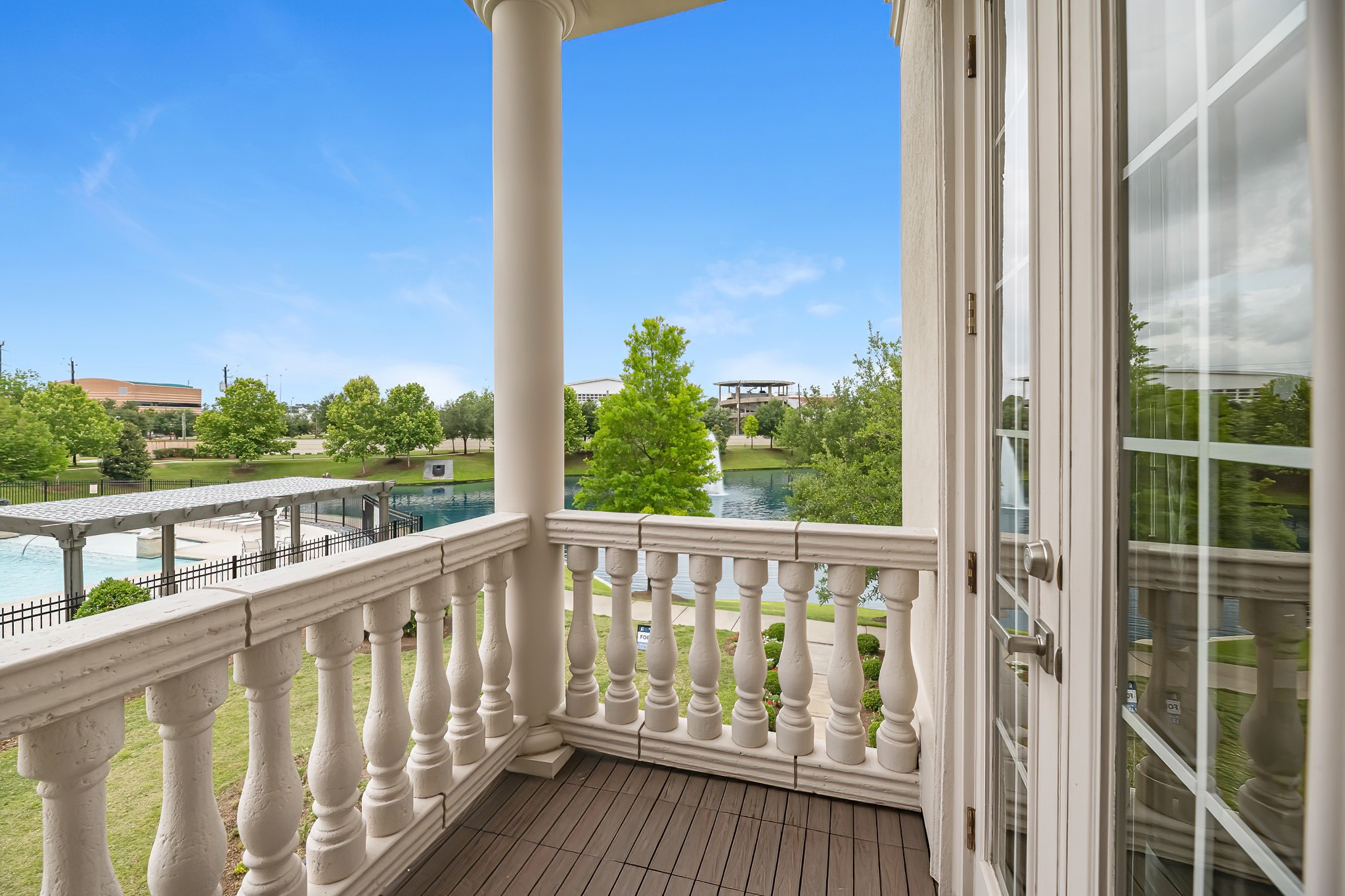 3709 Somerset Commons Lane Houston, TX 77055 - Photo 18 of 32 a view of a balcony with wooden floor