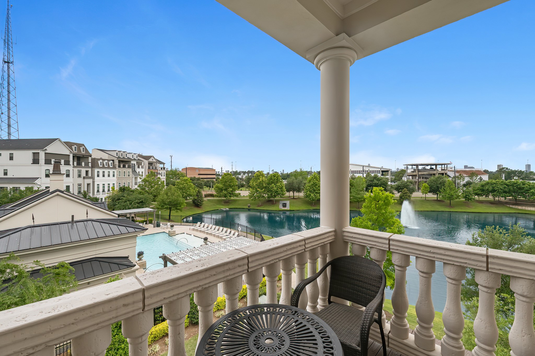 3709 Somerset Commons Lane Houston, TX 77055 - Photo 26 of 32 a view of a balcony with wooden floor and lake view