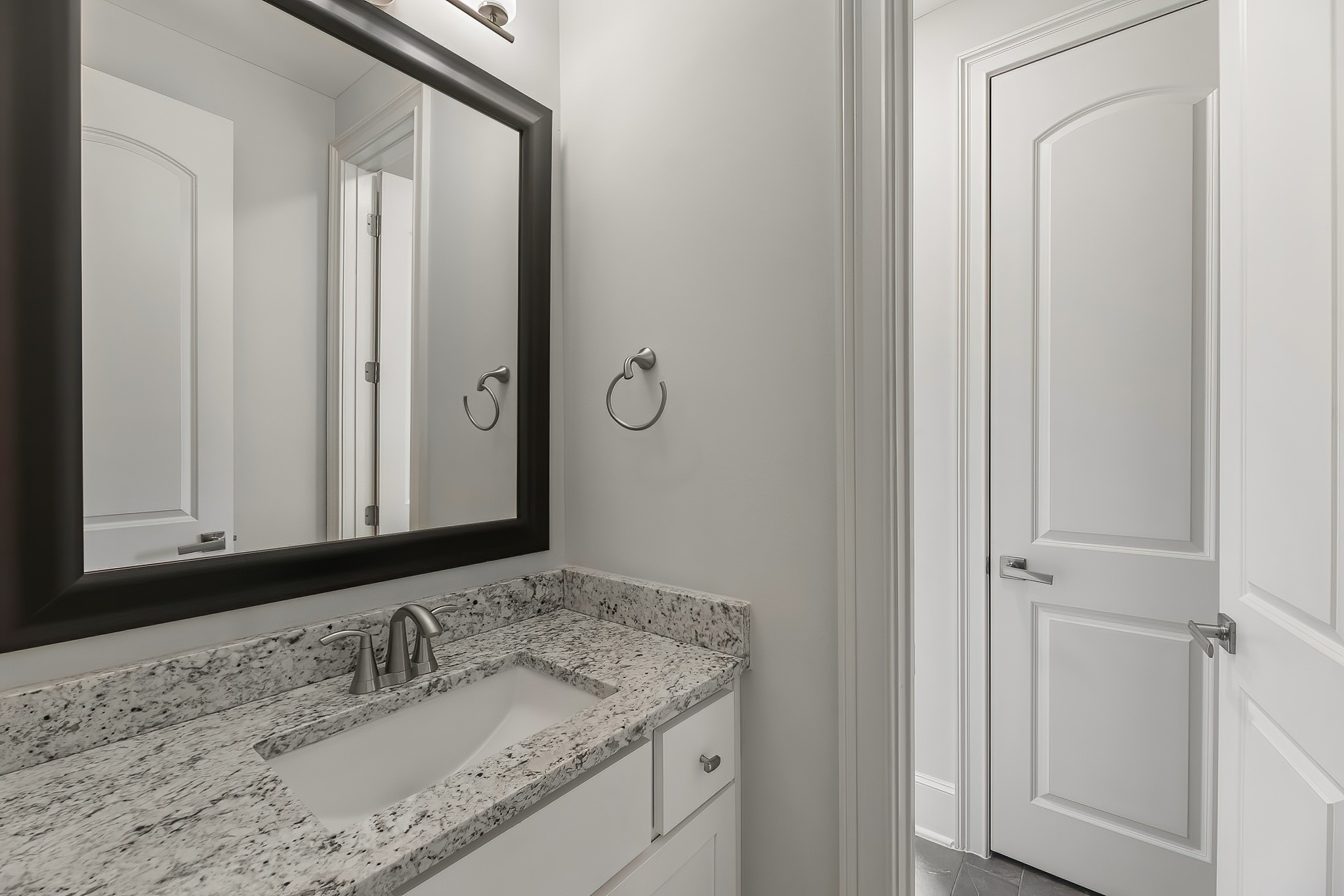 3709 Somerset Commons Lane Houston, TX 77055 - Photo 28 of 32 a bathroom with a granite countertop sink and a mirror