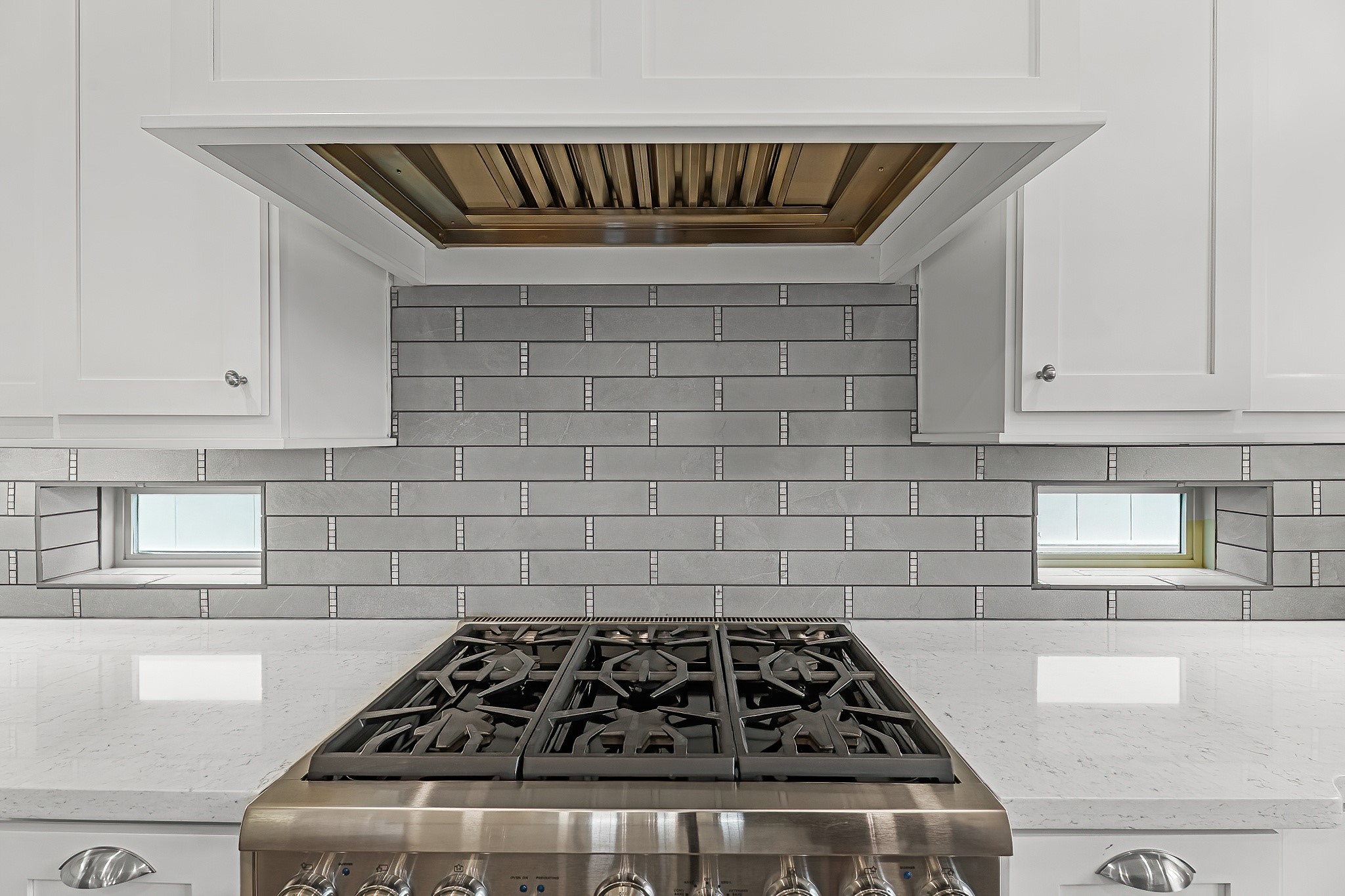 3709 Somerset Commons Lane Houston, TX 77055 - Photo 8 of 32 a close view of a stove a microwave and cabinets in the kitchen