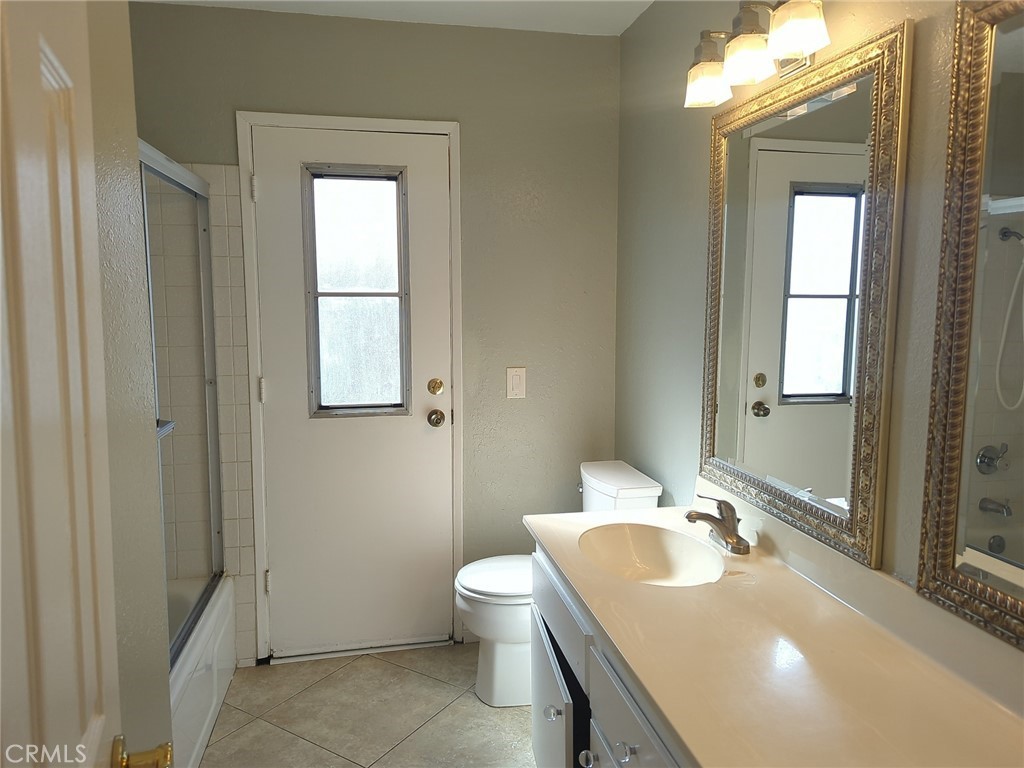 1331 Parkside Drive Riverside, CA 92506 - Photo 6 of 6 a bathroom with a sink toilet and vanity