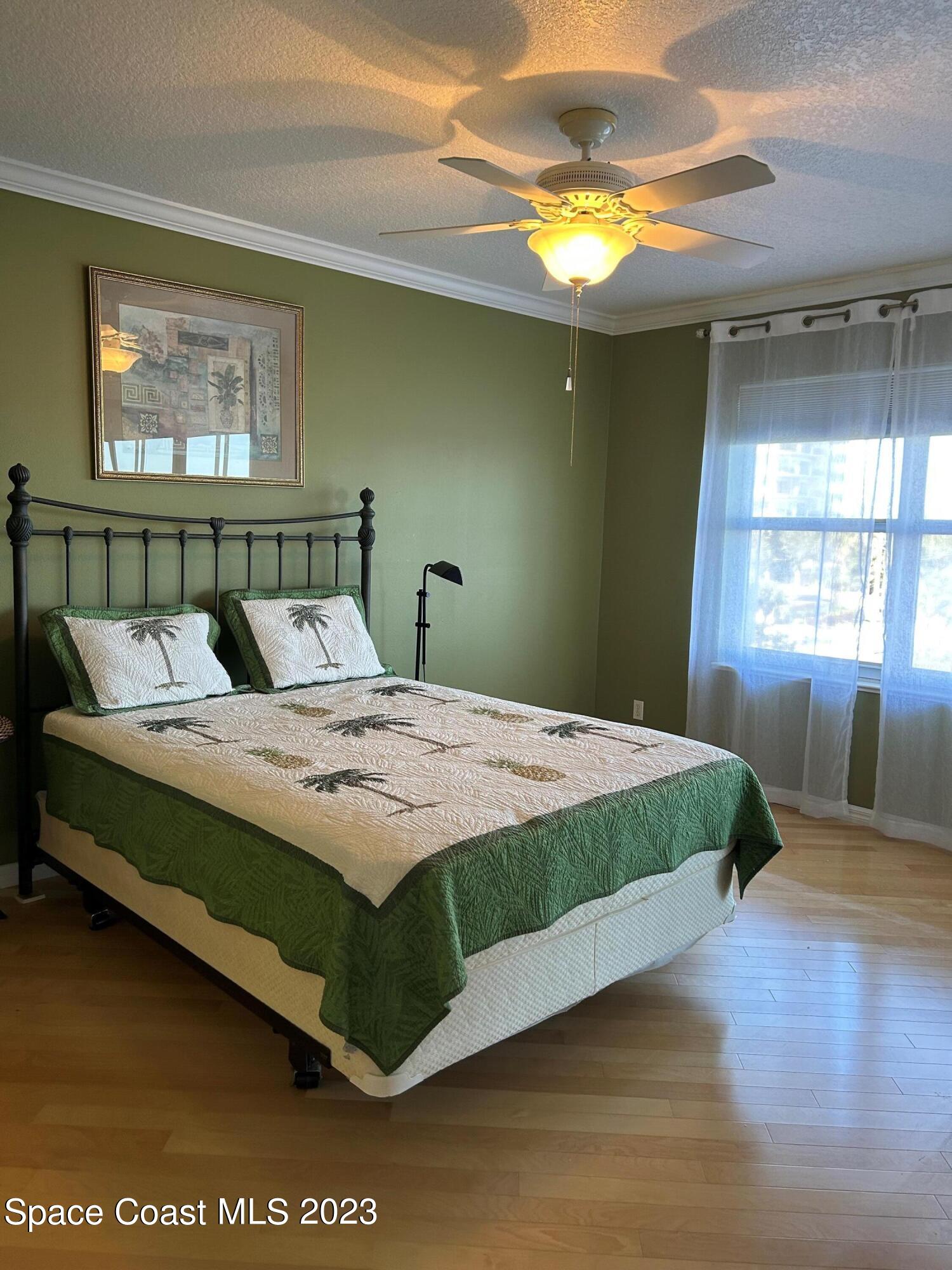 100 Riverside Drive, Unit 403 Cocoa, FL 32922 - Photo 11 of 30 a bedroom with a bed and window