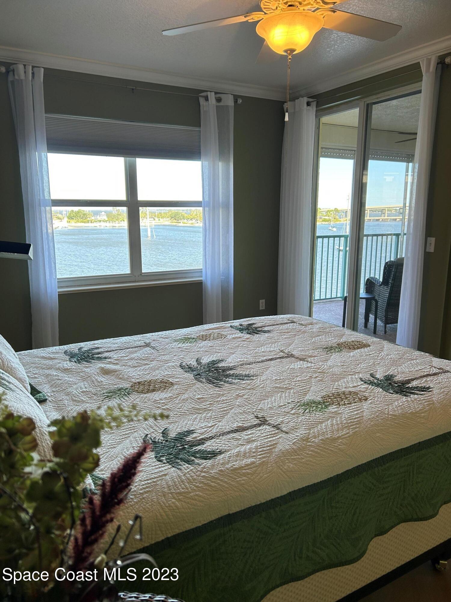 100 Riverside Drive, Unit 403 Cocoa, FL 32922 - Photo 12 of 30 a bedroom with a bed and a window