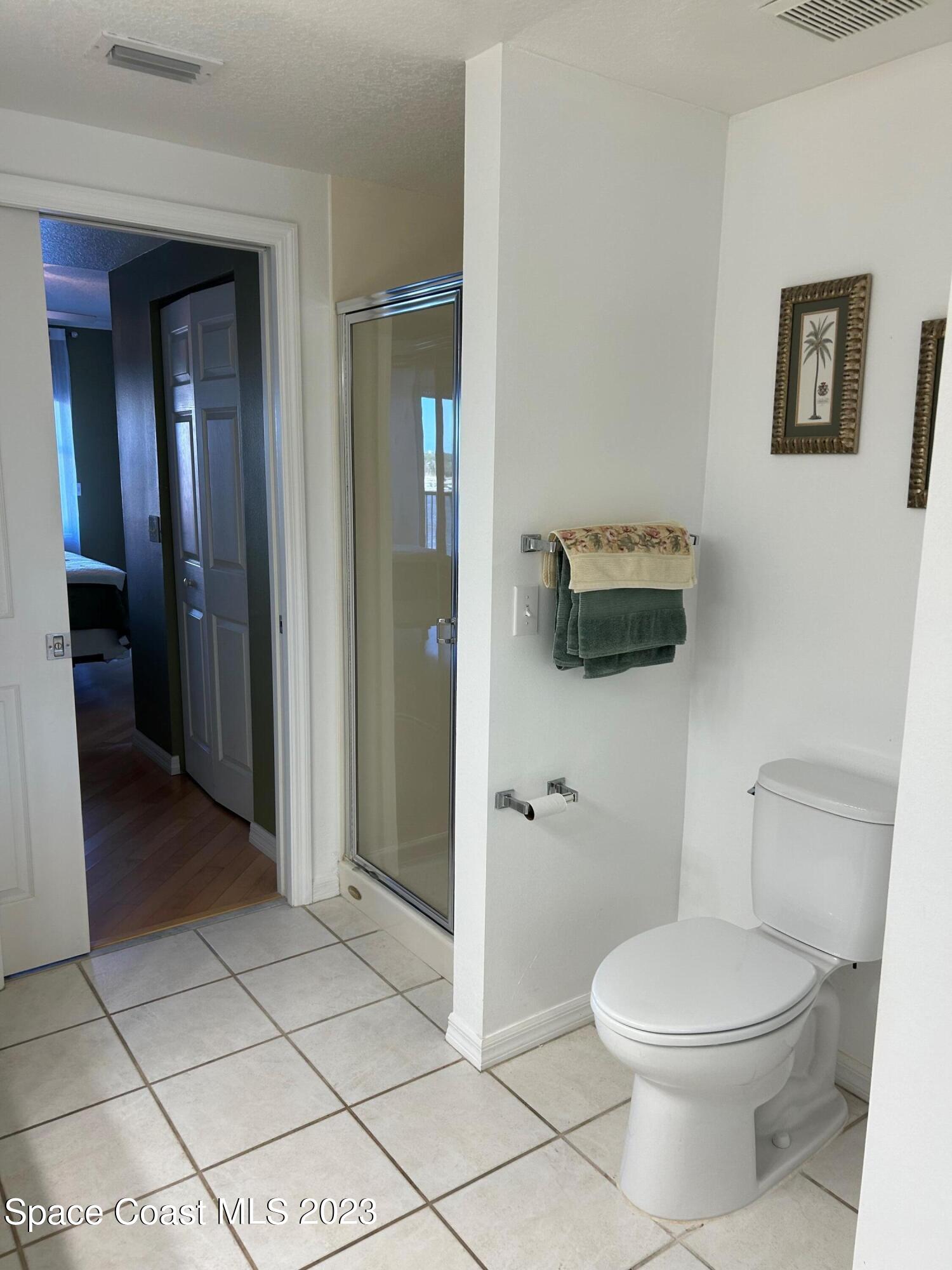 100 Riverside Drive, Unit 403 Cocoa, FL 32922 - Photo 15 of 30 a bathroom with a toilet and a shower
