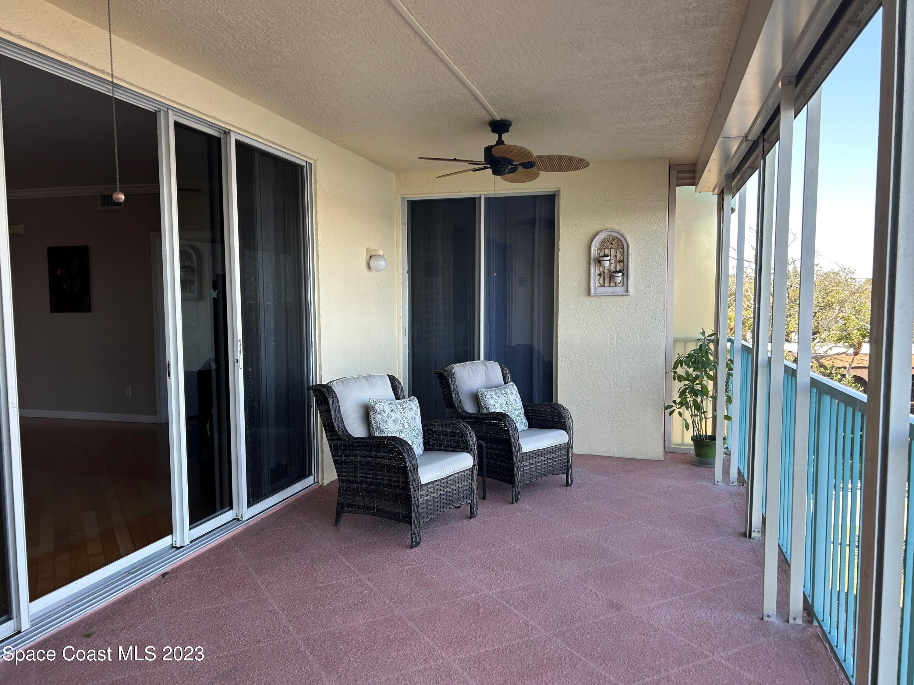 100 Riverside Drive, Unit 403 Cocoa, FL 32922 - Photo 20 of 30 a view of a livingroom with furniture and front door