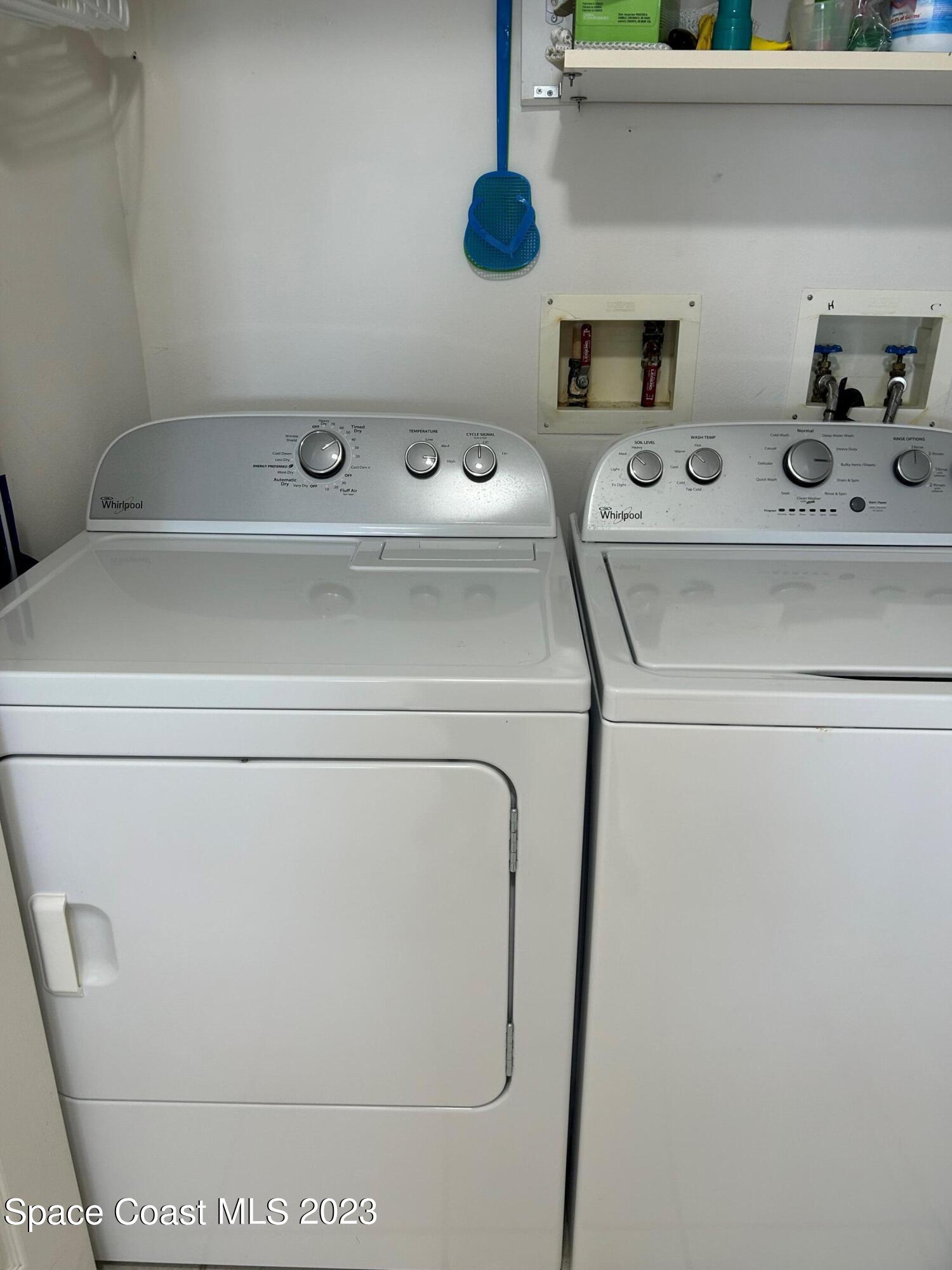 100 Riverside Drive, Unit 403 Cocoa, FL 32922 - Photo 21 of 30 a utility room with dryer and washer