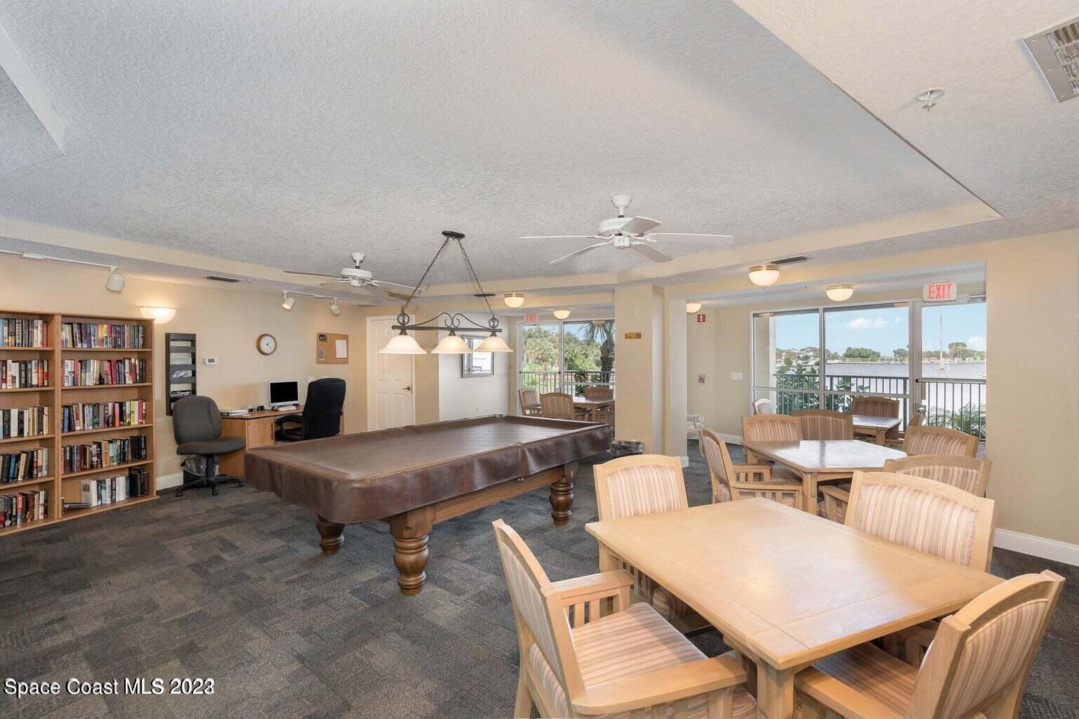 100 Riverside Drive, Unit 403 Cocoa, FL 32922 - Photo 27 of 30 a living room with furniture a rug and white walls