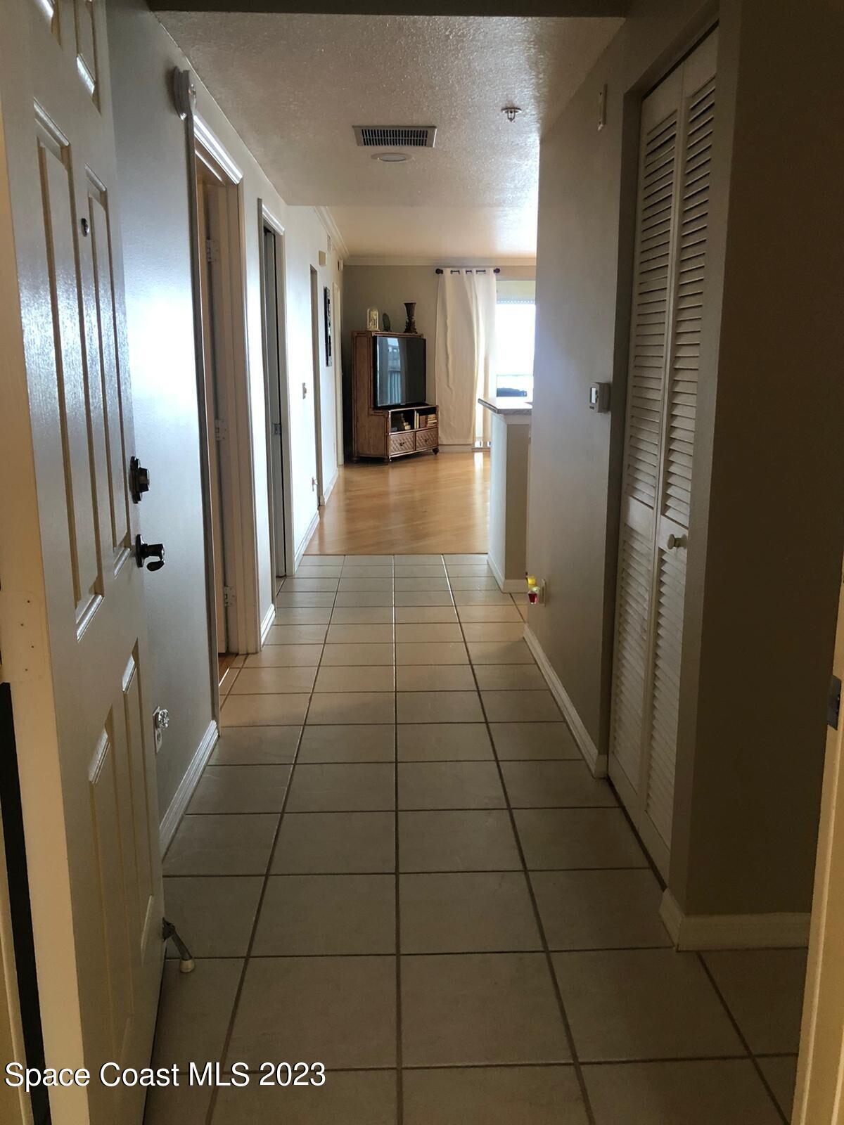100 Riverside Drive, Unit 403 Cocoa, FL 32922 - Photo 4 of 30 a view of a hallway with interior of the house