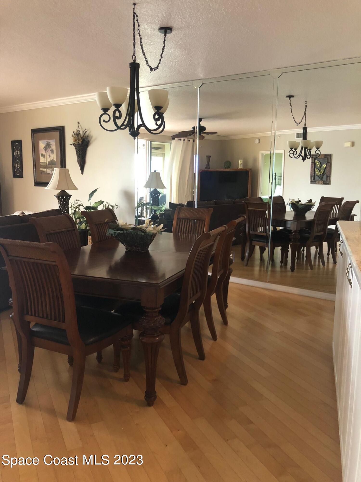100 Riverside Drive, Unit 403 Cocoa, FL 32922 - Photo 6 of 30 a view of a dining room with furniture