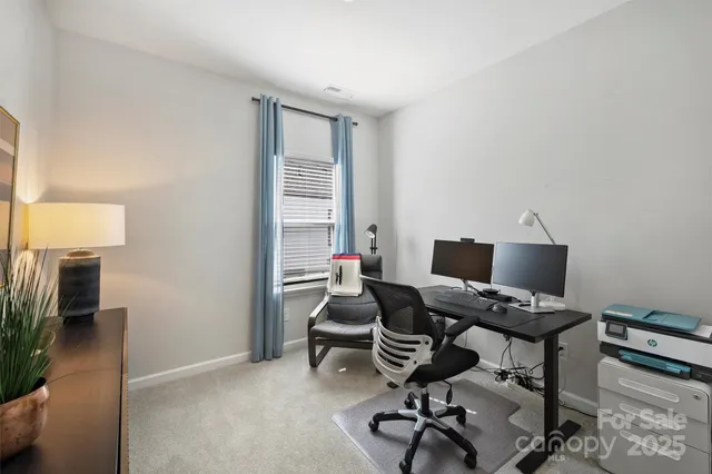 a workspace with furniture and a window