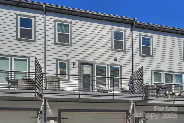 a view of a house with a window and balcony