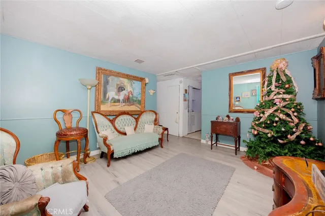 a living room with furniture and flowers