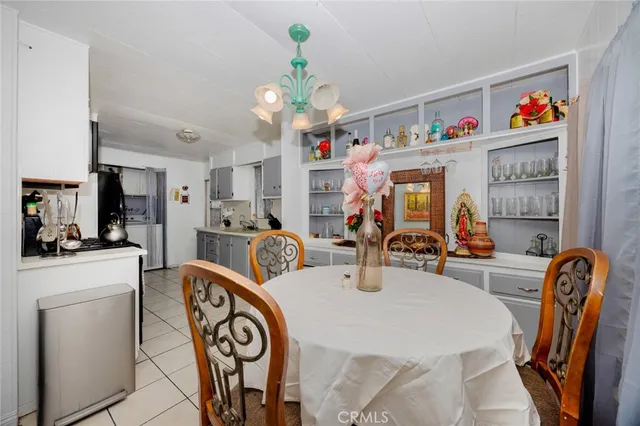 a very nice looking dining room with furniture
