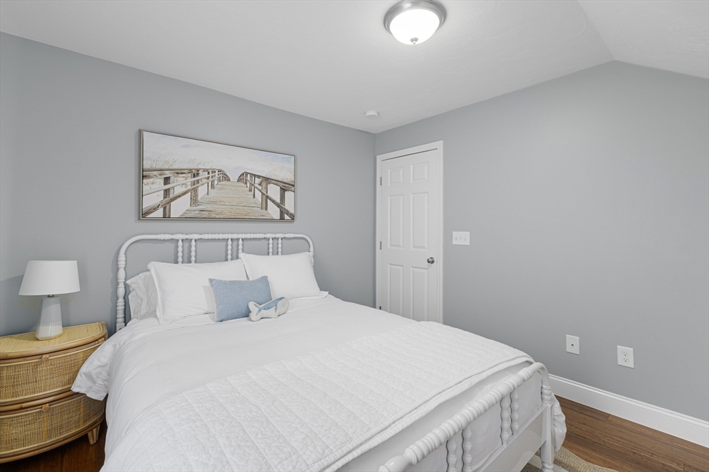 69 Denver Street Fall River, MA 02721 - Photo 34 of 35 a bedroom with a bed and a painting on the wall