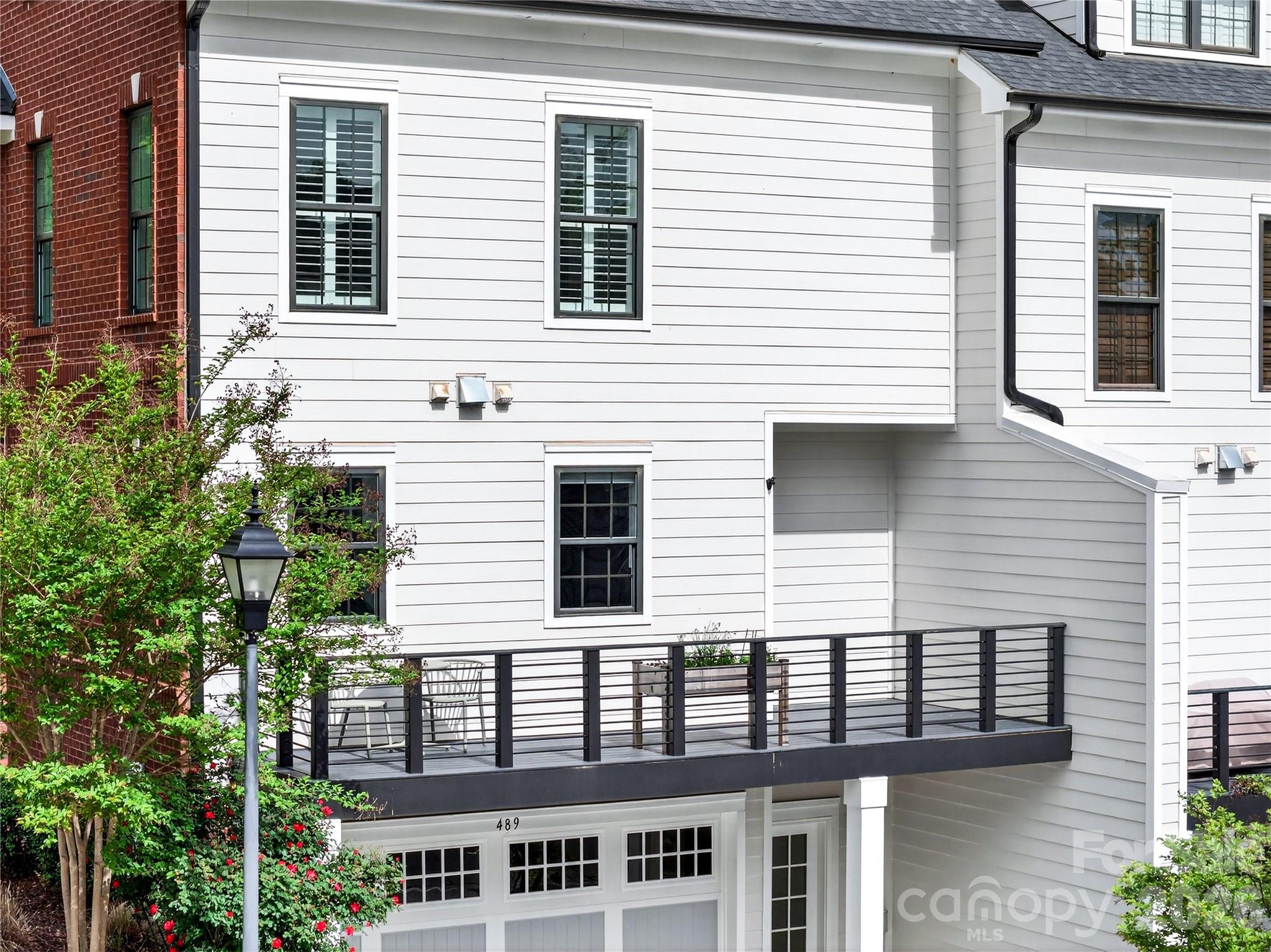 489 South Main Street Davidson, NC 28036 - Photo 16 of 43 a view of a house next to a yard