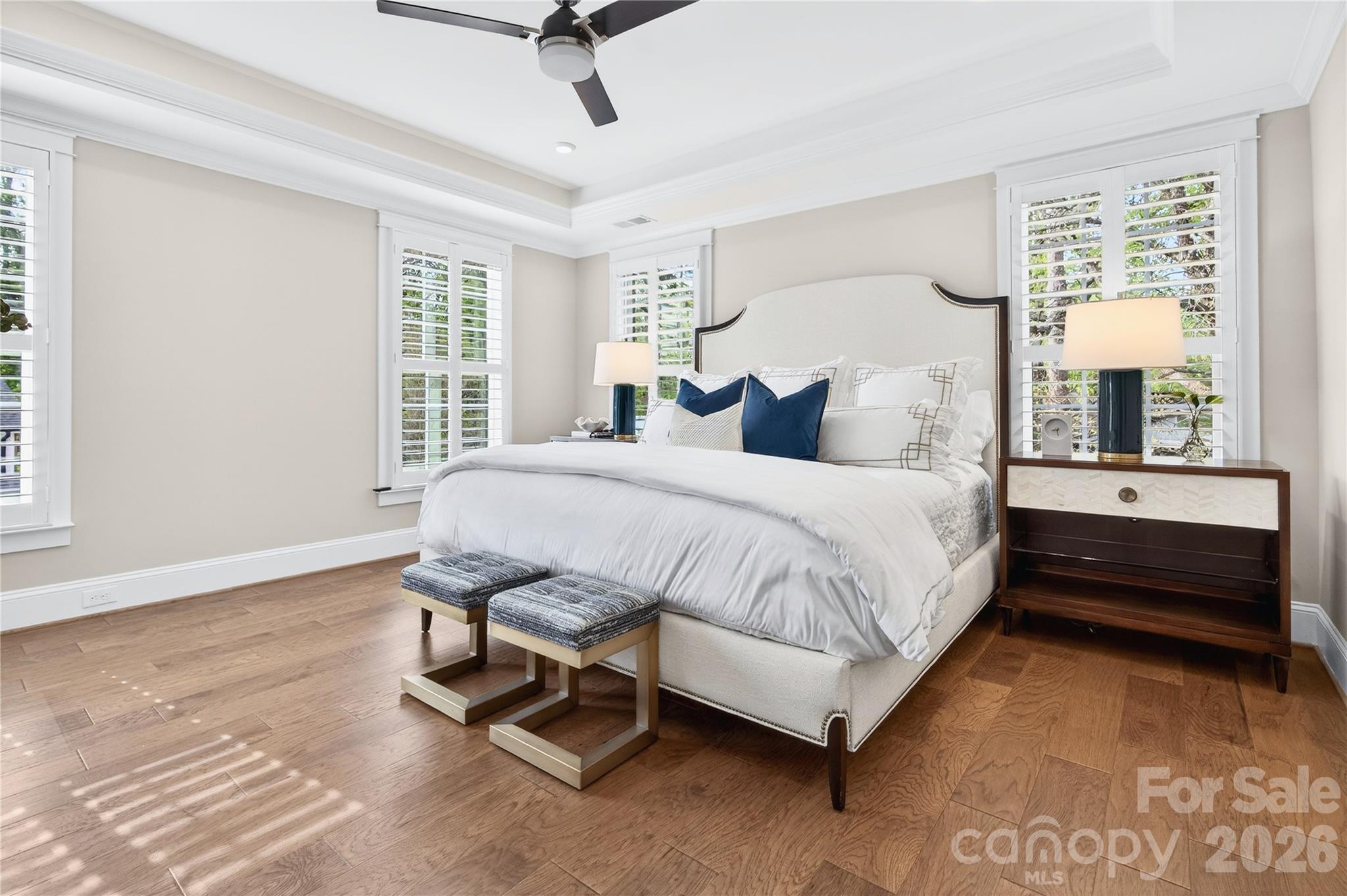 489 South Main Street Davidson, NC 28036 - Photo 19 of 43 a spacious bedroom with a bed and a large window