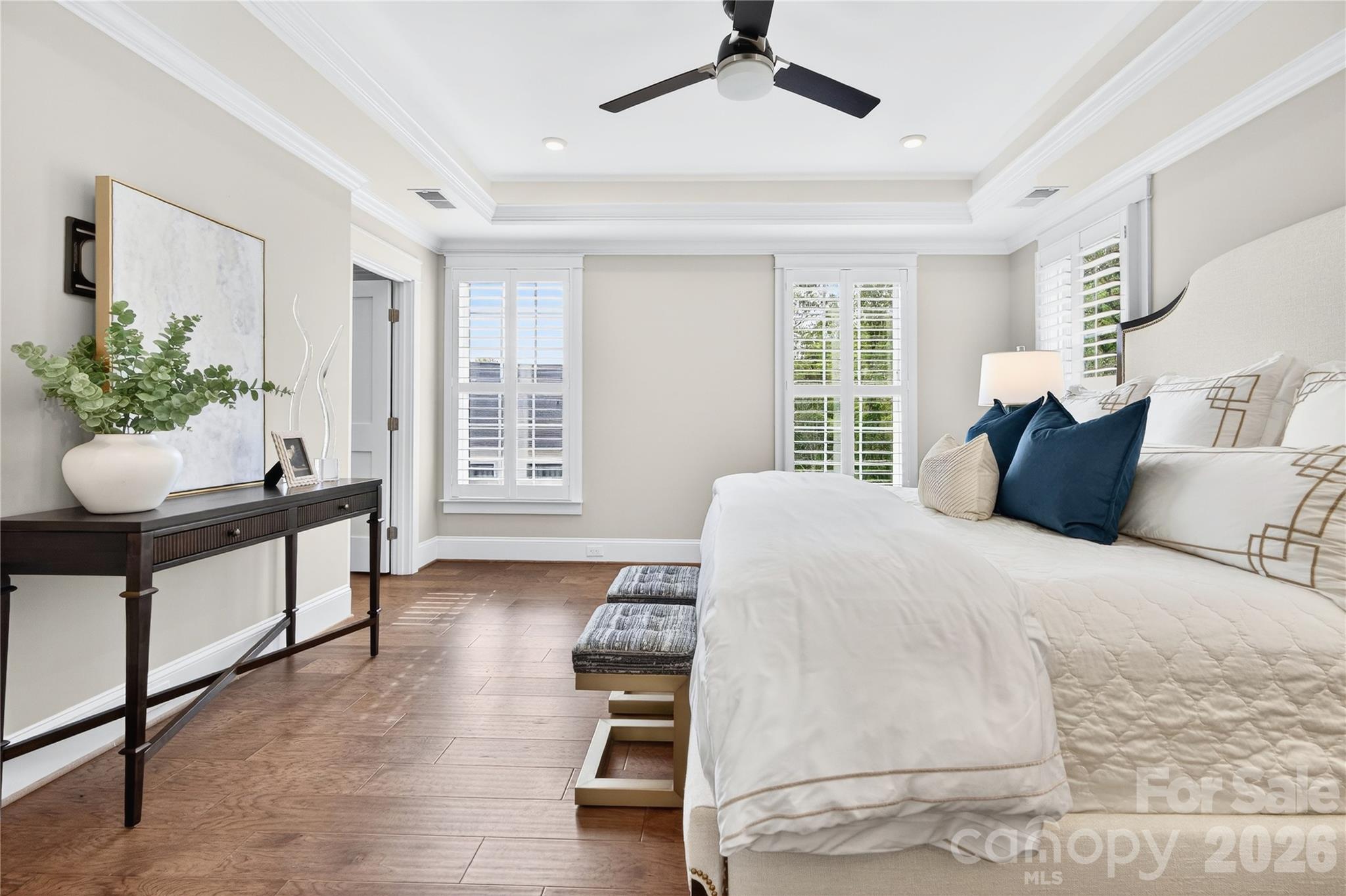 489 South Main Street Davidson, NC 28036 - Photo 20 of 43 a bedroom with a bed and a potted plant