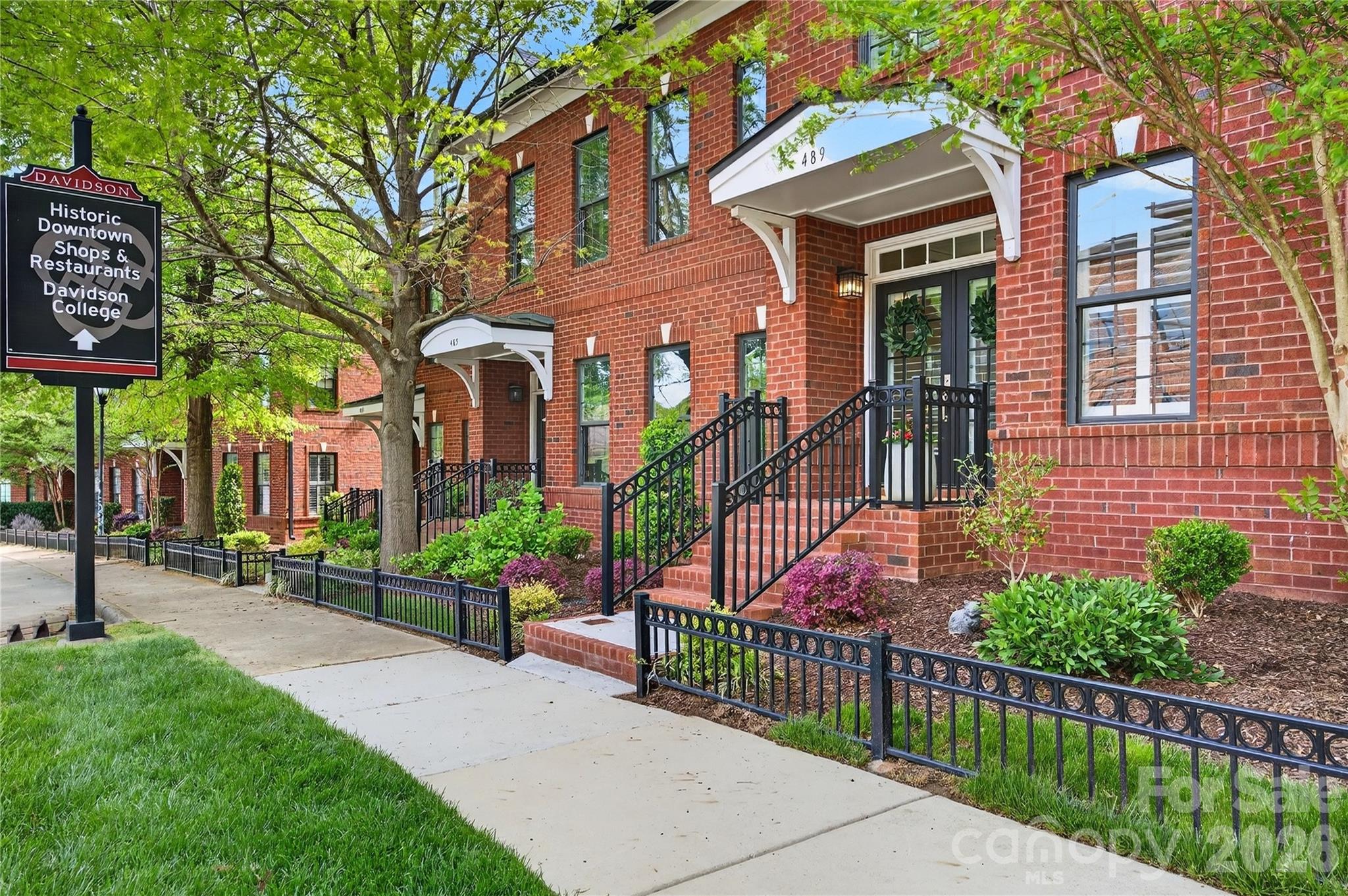 489 South Main Street Davidson, NC 28036 - Photo 2 of 43 a front view of a house with iron fence