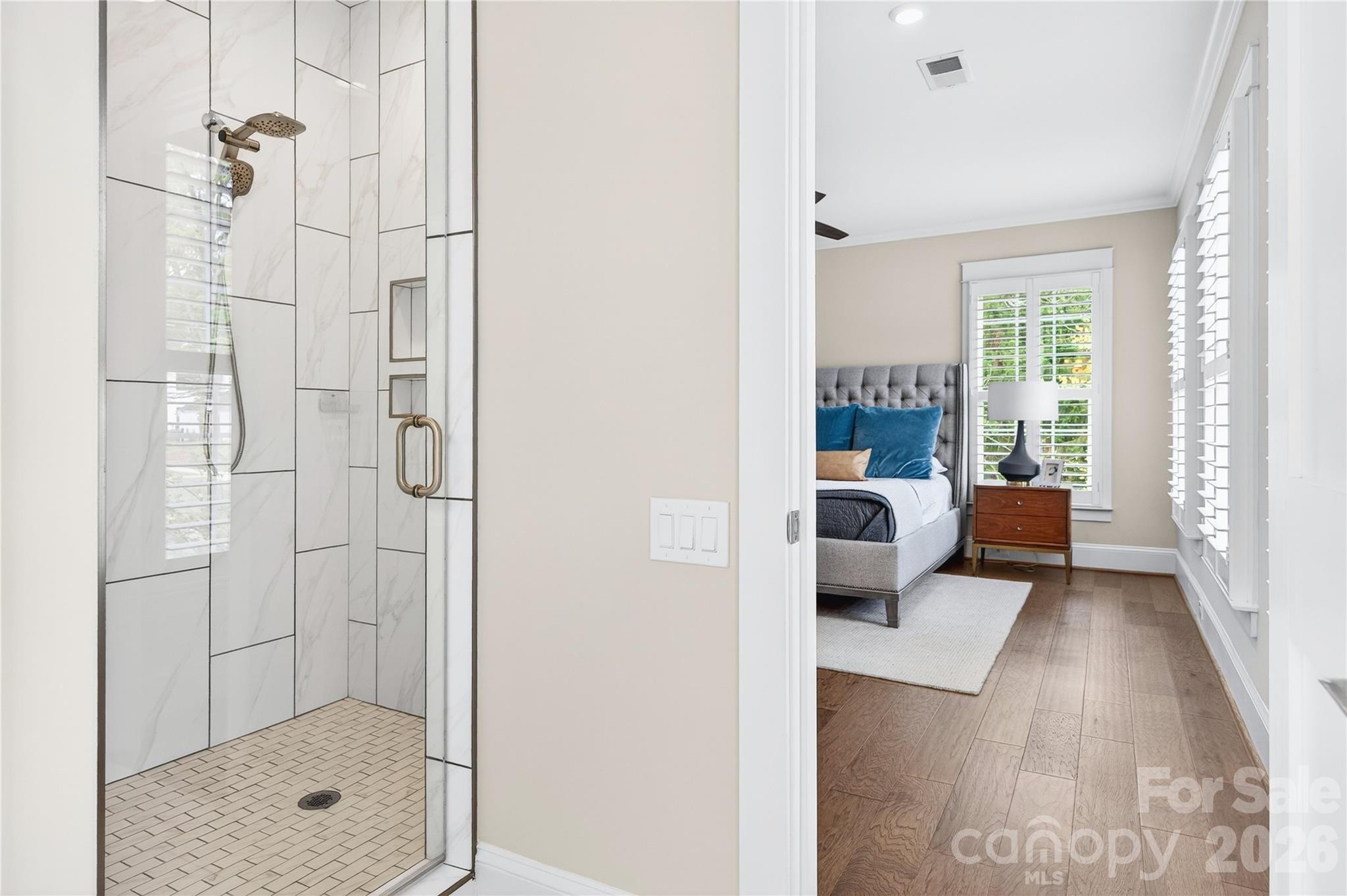 489 South Main Street Davidson, NC 28036 - Photo 30 of 43 a bathroom with a glass shower door and a glass door