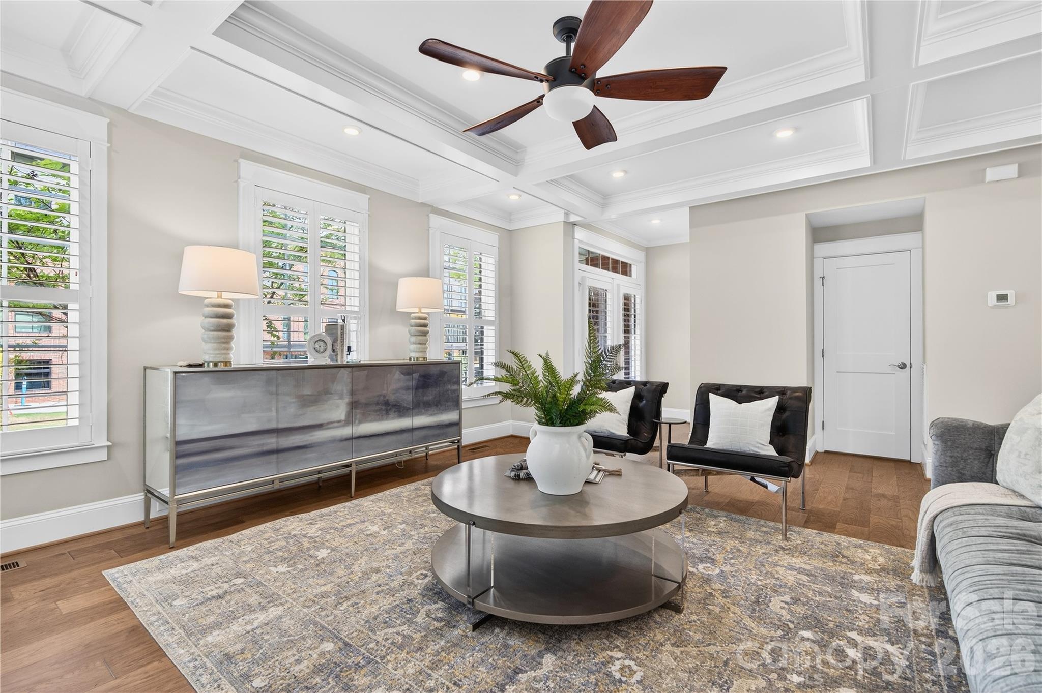 489 South Main Street Davidson, NC 28036 - Photo 3 of 43 a living room with furniture and a potted plant