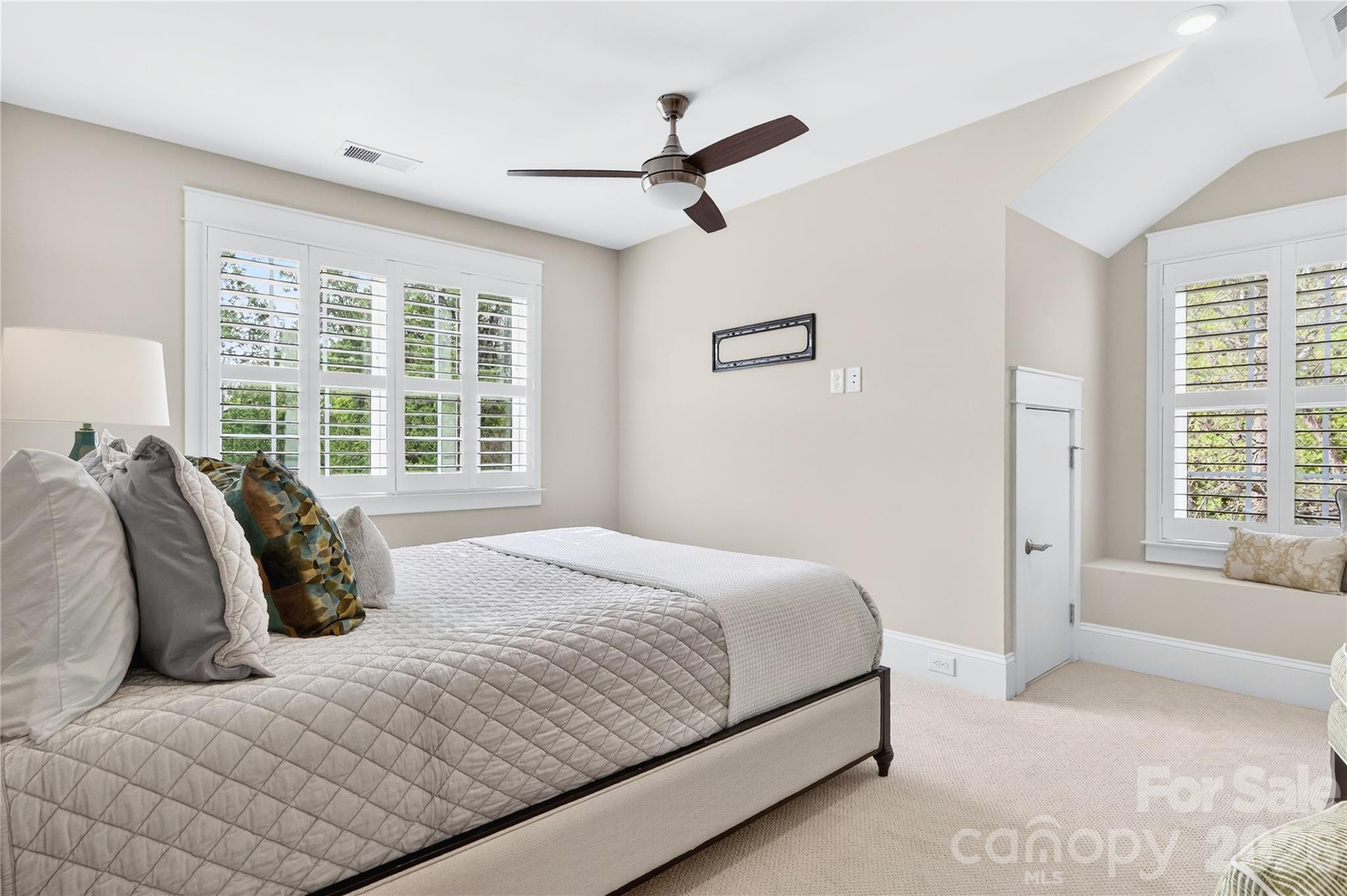 489 South Main Street Davidson, NC 28036 - Photo 33 of 43 a bedroom with a bed and a large window