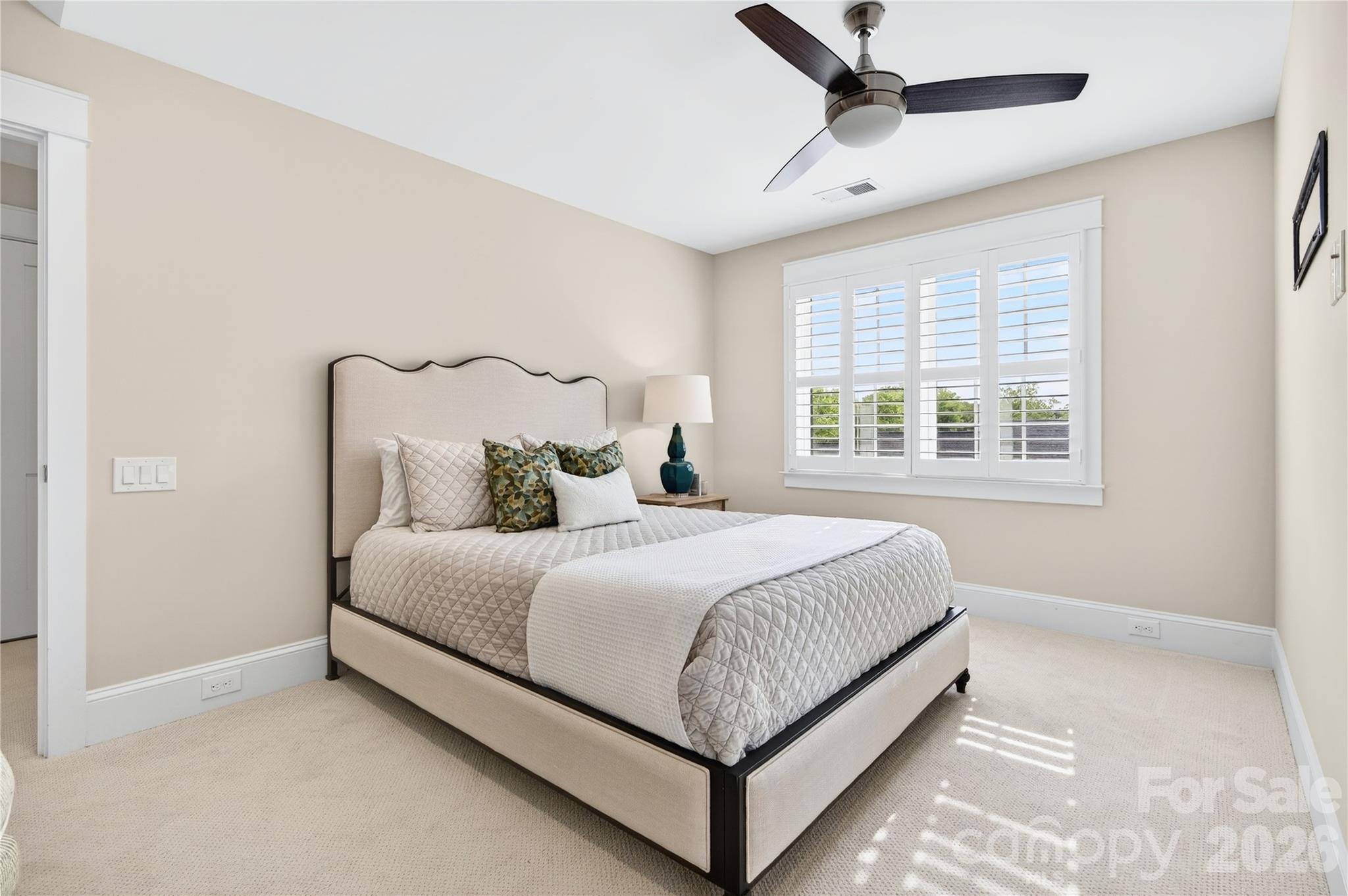 489 South Main Street Davidson, NC 28036 - Photo 34 of 43 a bed sitting in a bedroom next to a window