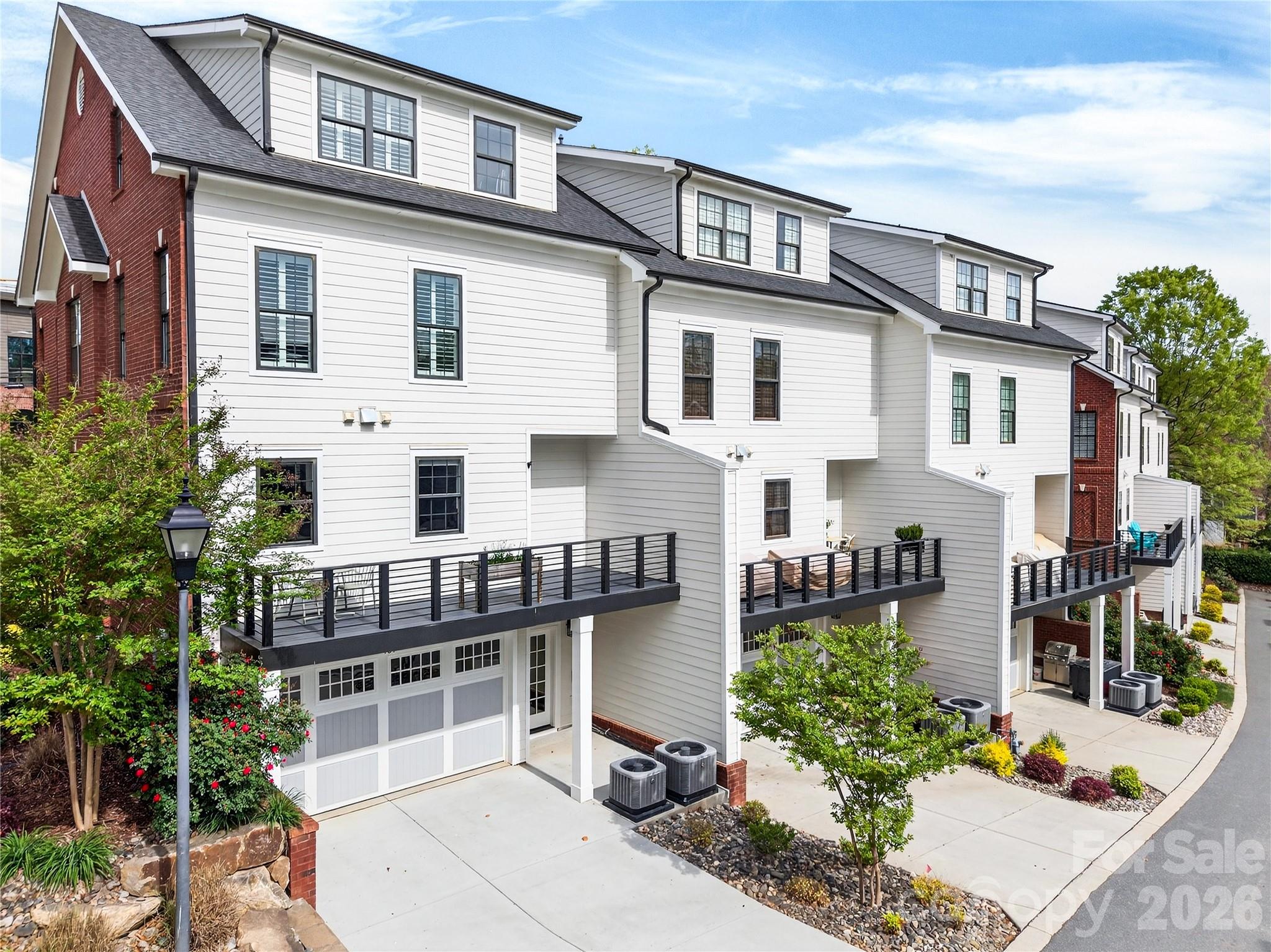 489 South Main Street Davidson, NC 28036 - Photo 37 of 43 a front view of a house with a garden