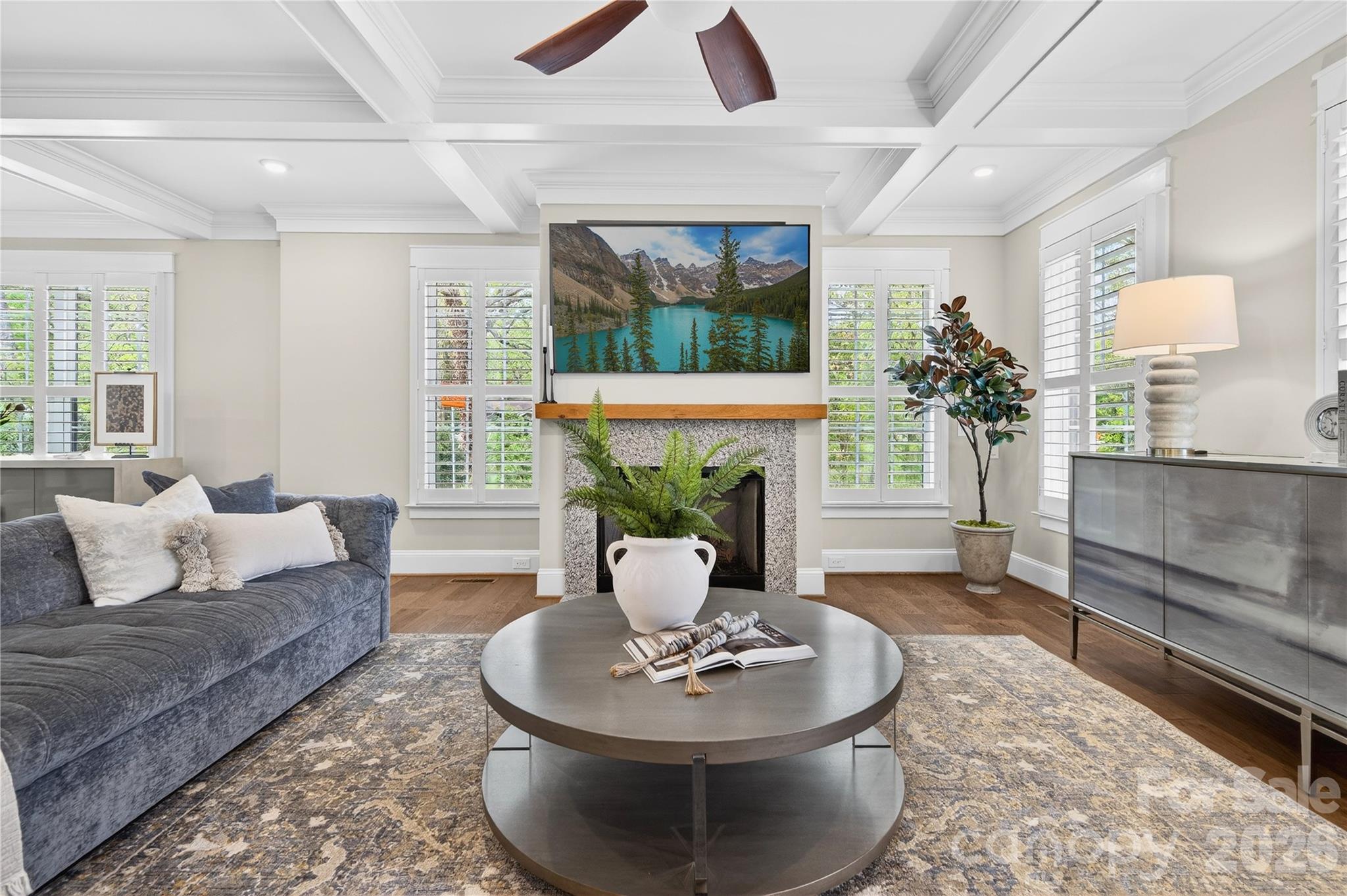489 South Main Street Davidson, NC 28036 - Photo 4 of 43 a living room with furniture a fireplace and a large window