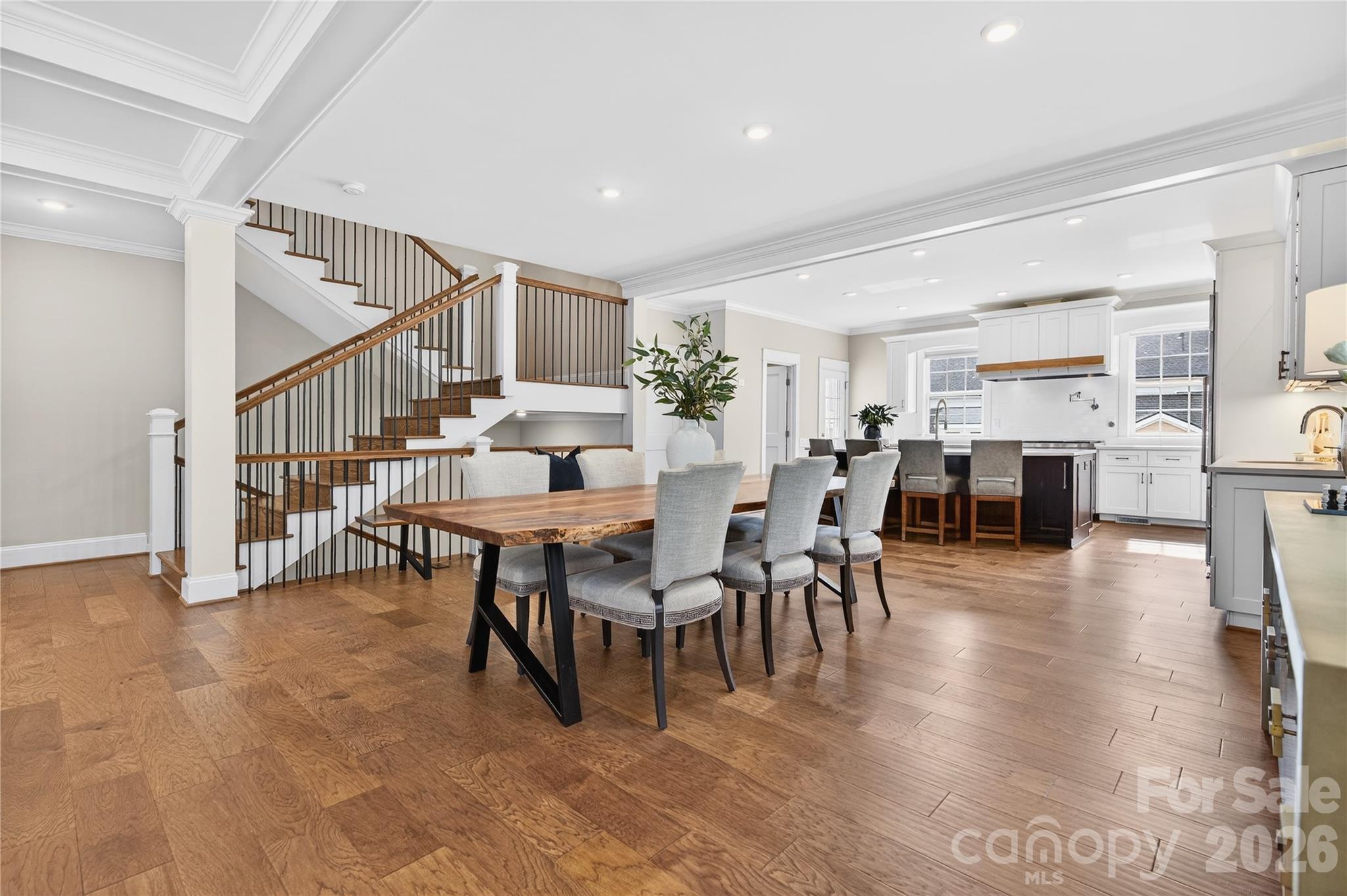 489 South Main Street Davidson, NC 28036 - Photo 6 of 43 a dining room with furniture wooden floor and a rug