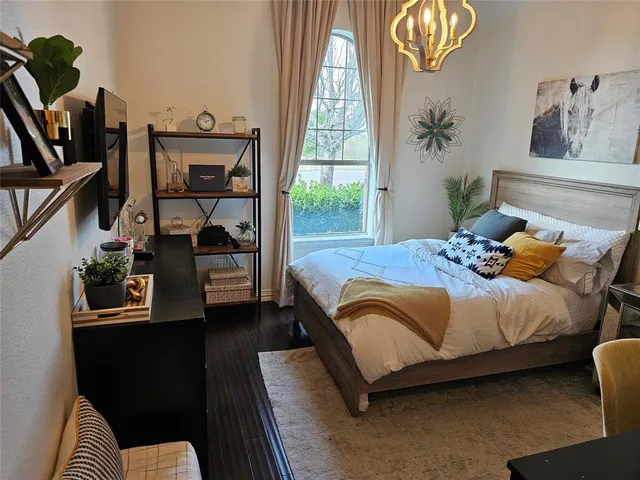 a view of walk in closet with clothes