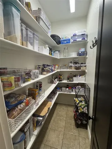 a view of bathroom with mirror toilet and a sink
