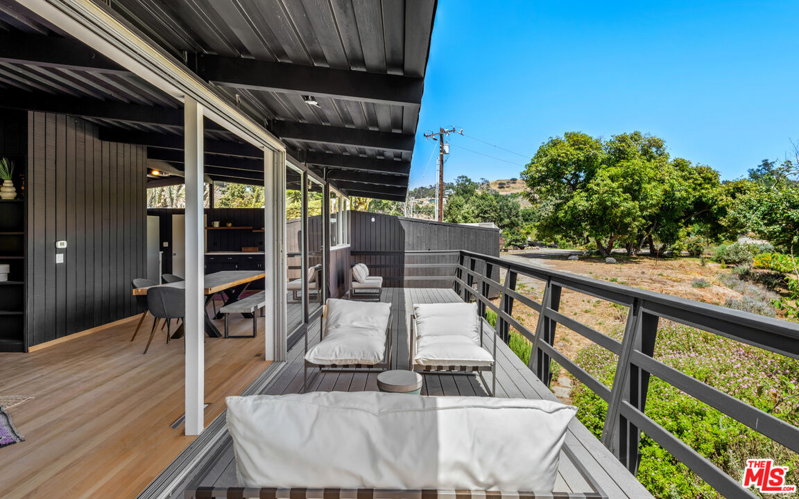 6009 Bonsall Drive Malibu, CA 90265 - Photo 13 of 49 a view of balcony with wooden floor and seating space