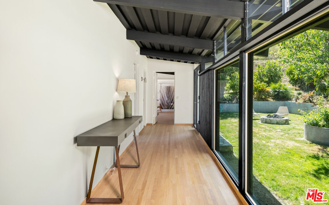6009 Bonsall Drive Malibu, CA 90265 - Photo 17 of 49 a view of hallway with furniture and wooden floor