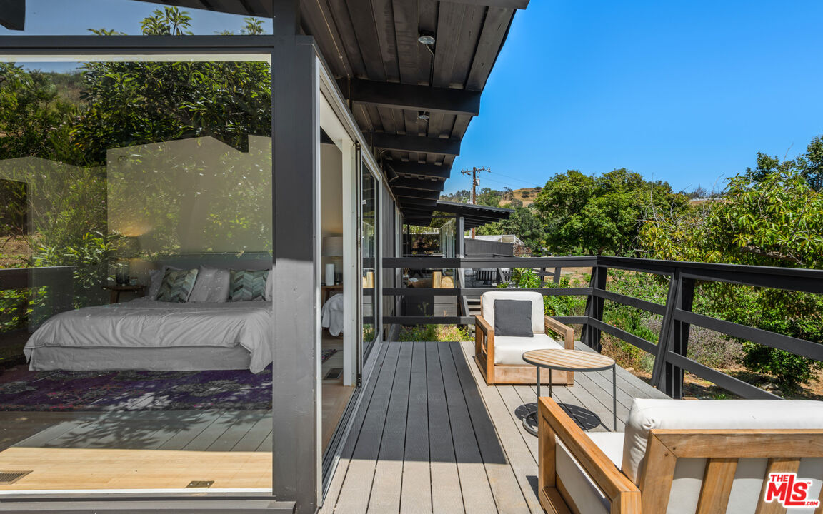 6009 Bonsall Drive Malibu, CA 90265 - Photo 20 of 49 a view of a balcony with chairs