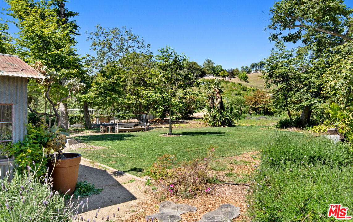 6009 Bonsall Drive Malibu, CA 90265 - Photo 35 of 49 a view of a house with backyard and sitting area