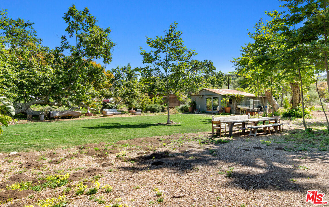 6009 Bonsall Drive Malibu, CA 90265 - Photo 36 of 49 a view of a house with backyard and sitting area